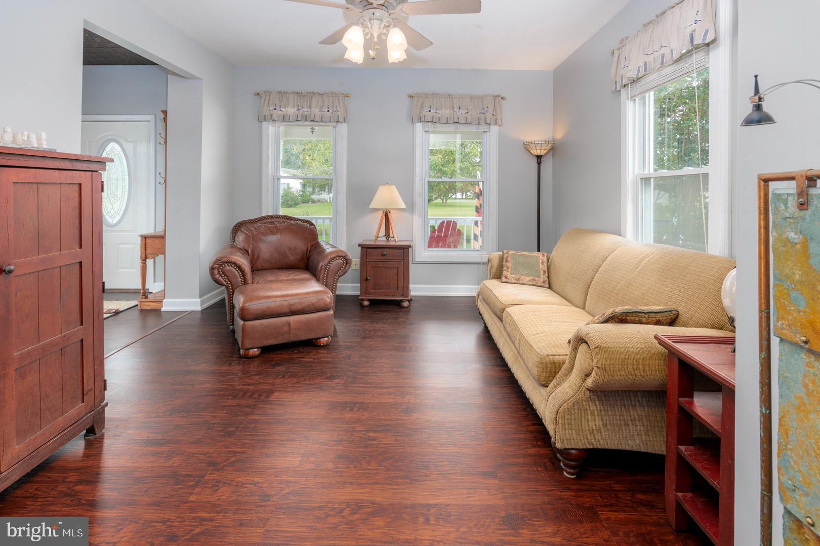 4904 Ravenwood Road Vienna, MD 21869 - Photo 9 of 42 a living room with furniture and a large window