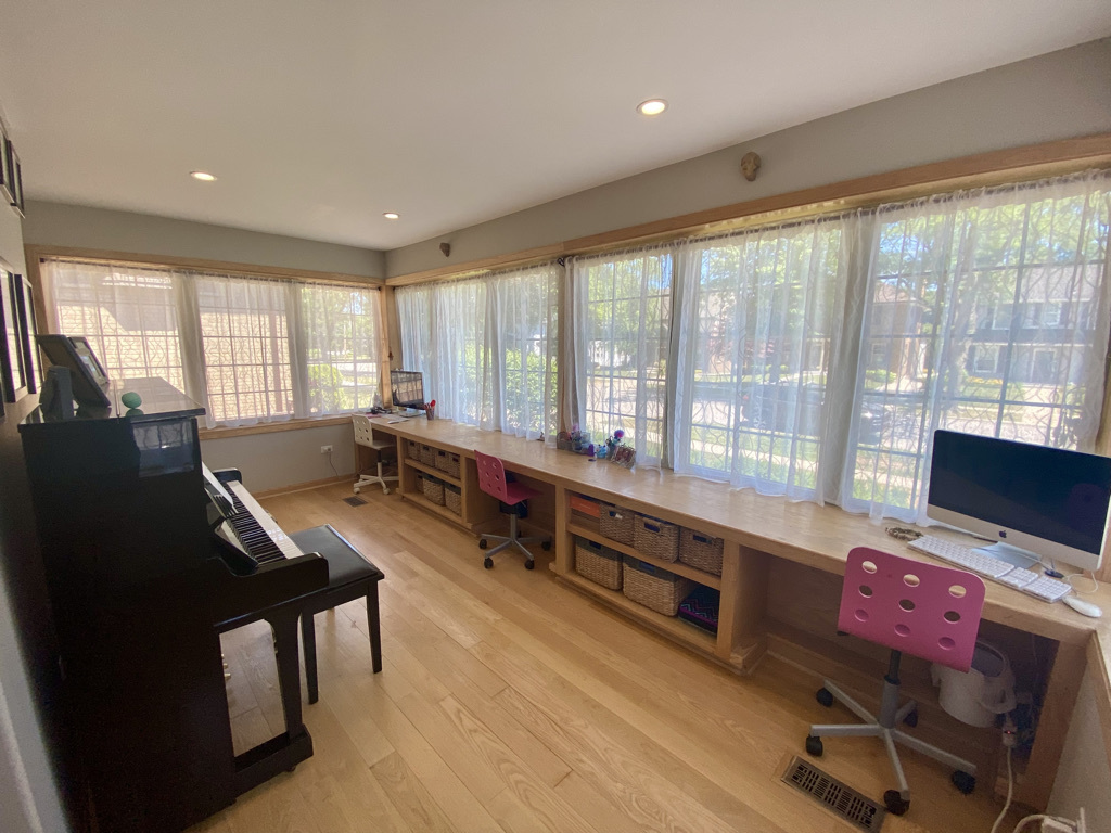 420 North Washington Avenue Park Ridge, IL 60068 - Photo 12 of 36 a living room with furniture a flat screen tv and large windows