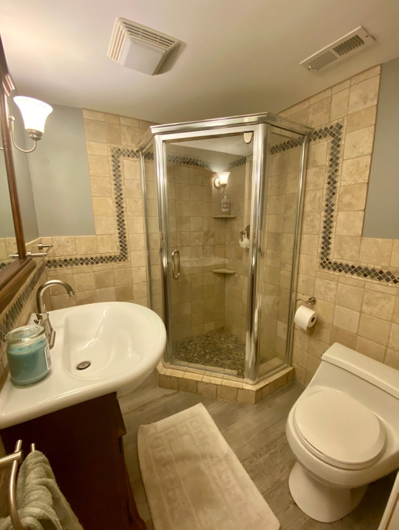 420 North Washington Avenue Park Ridge, IL 60068 - Photo 28 of 36 a bathroom with a sink toilet and shower