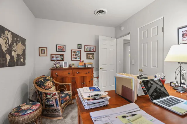 a living room with furniture and a table