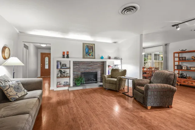 a living room with furniture and a fireplace