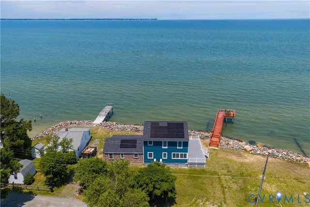 a aerial view of a house with a lake view