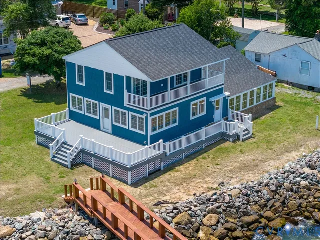 an aerial view of a house with swimming pool