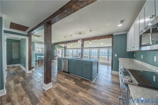 a room with lots of wooden furniture wooden floor and a window