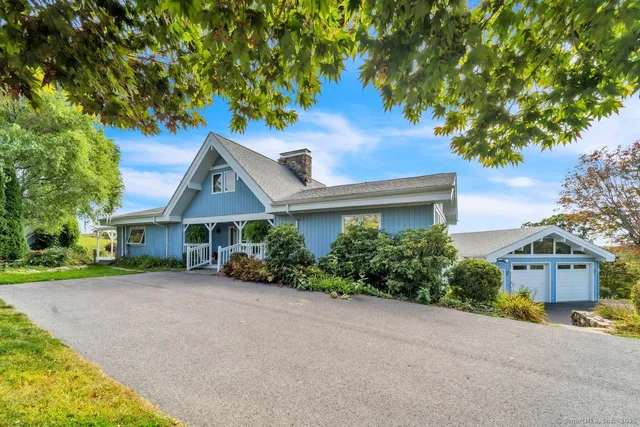front view of a house with a garden