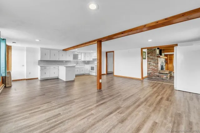 a bathroom with a white toilet sitting next to a white sink