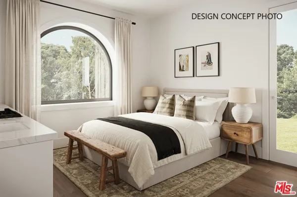 a bedroom with a bed and a table