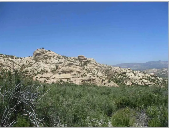 a view of a large building with a mountain in the background