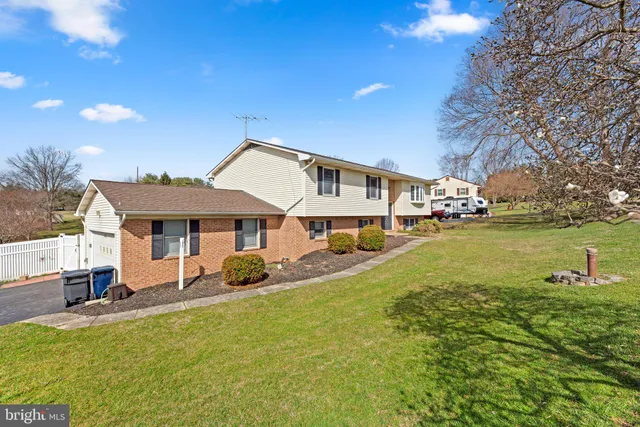 a view of a swimming pool with a table and chairs