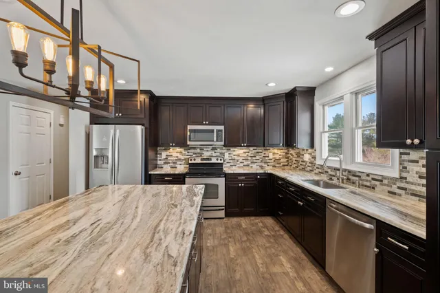 a view of a yard with chairs