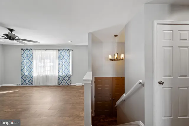 a view of a balcony with wooden floor