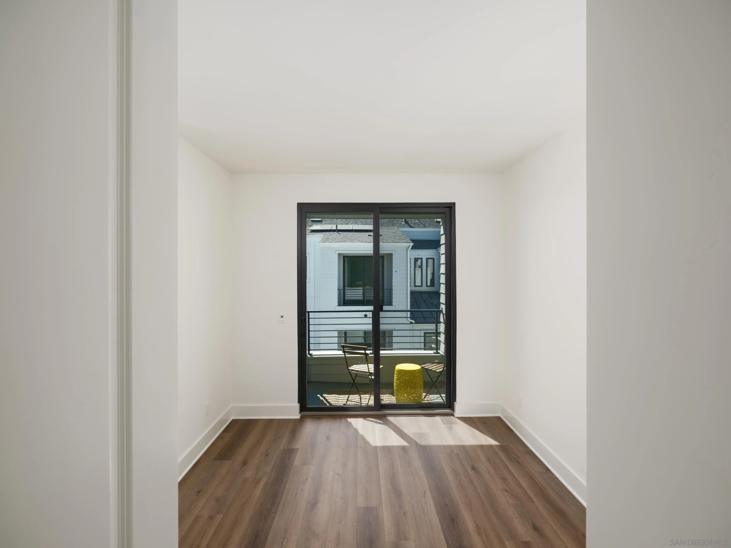 1301 Bergamo Place, Unit 101 Encinitas, CA 92024 - Photo 19 of 43 a view of a room with wooden floor and a sink