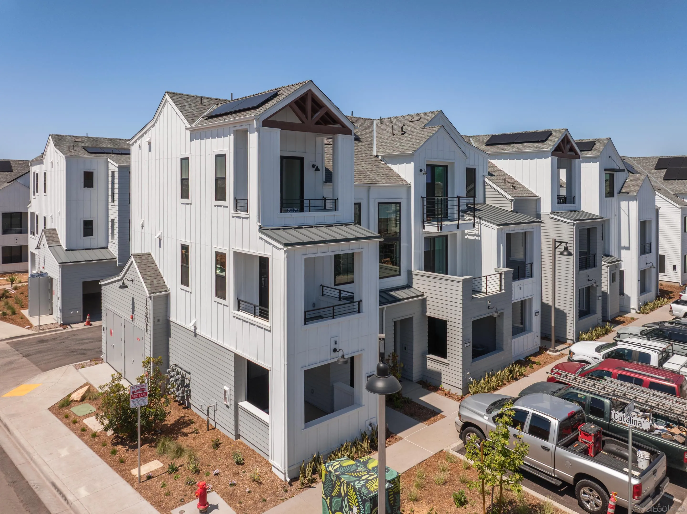 1301 Bergamo Place, Unit 101 Encinitas, CA 92024 - Photo 28 of 43 a view of a street with tall buildings