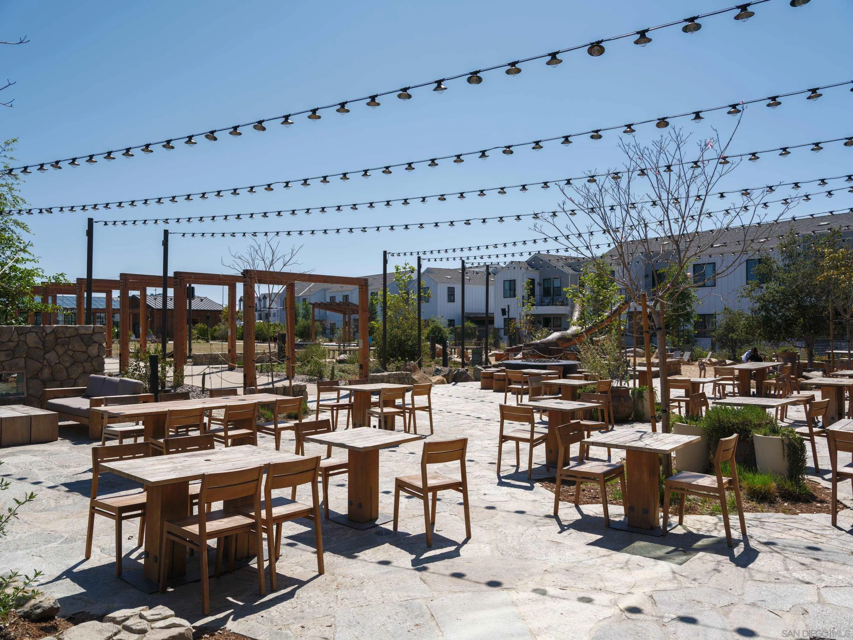 1301 Bergamo Place, Unit 101 Encinitas, CA 92024 - Photo 32 of 43 a view of a swimming pool with outdoor seating