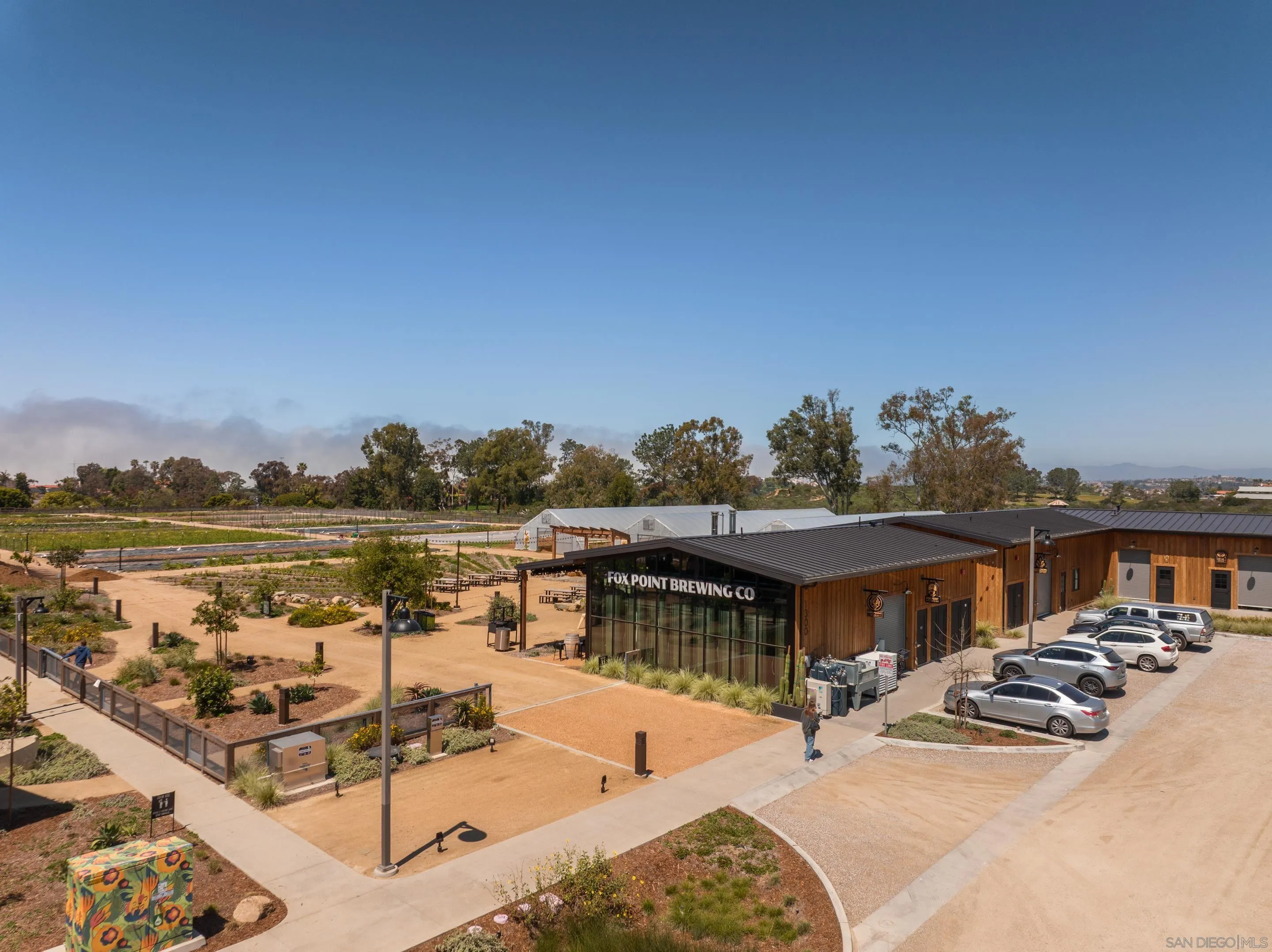 1301 Bergamo Place, Unit 101 Encinitas, CA 92024 - Photo 33 of 43 a roof deck with table and chairs a barbeque