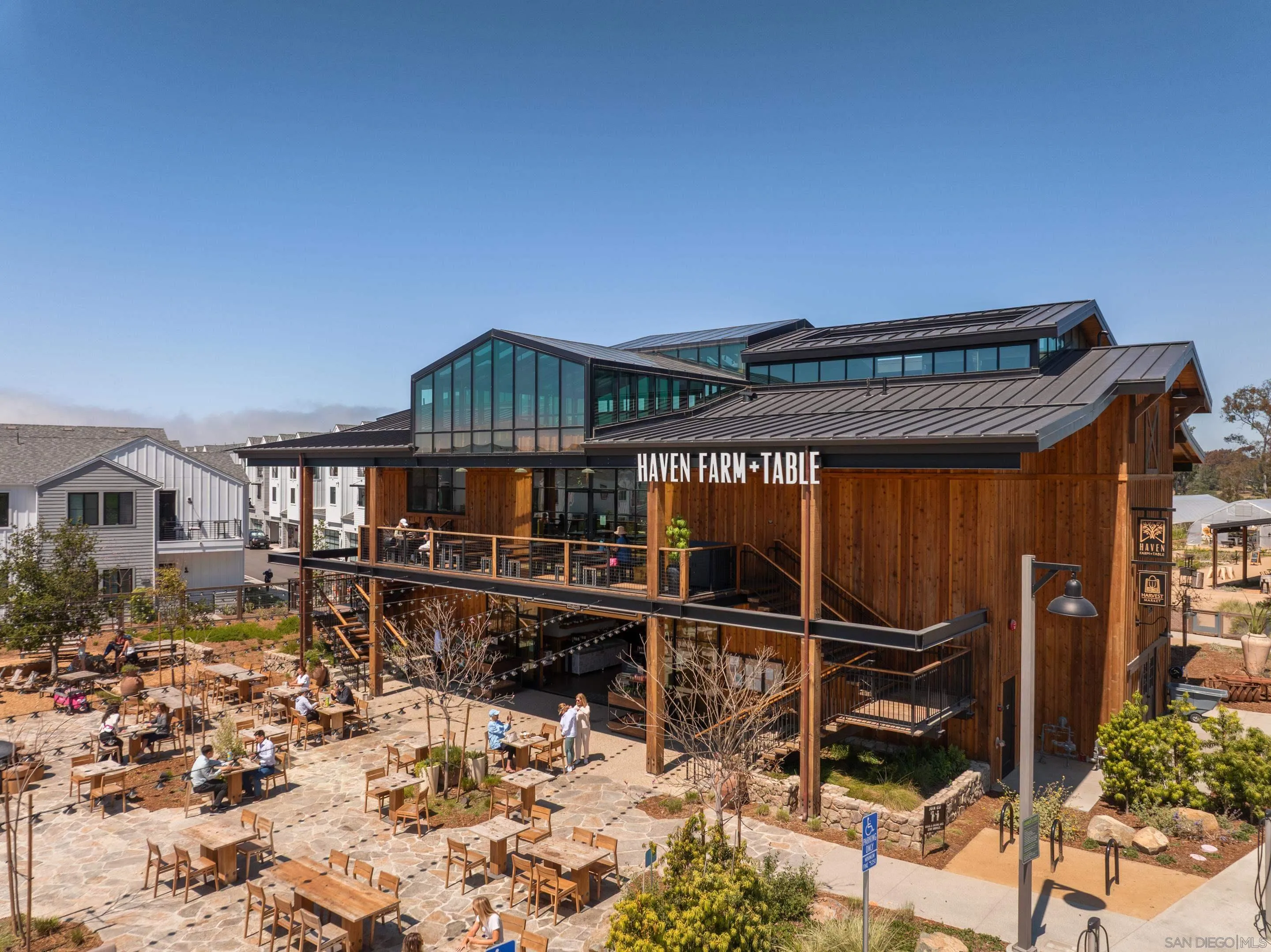 1301 Bergamo Place, Unit 101 Encinitas, CA 92024 - Photo 4 of 43 a front view of a house with balcony