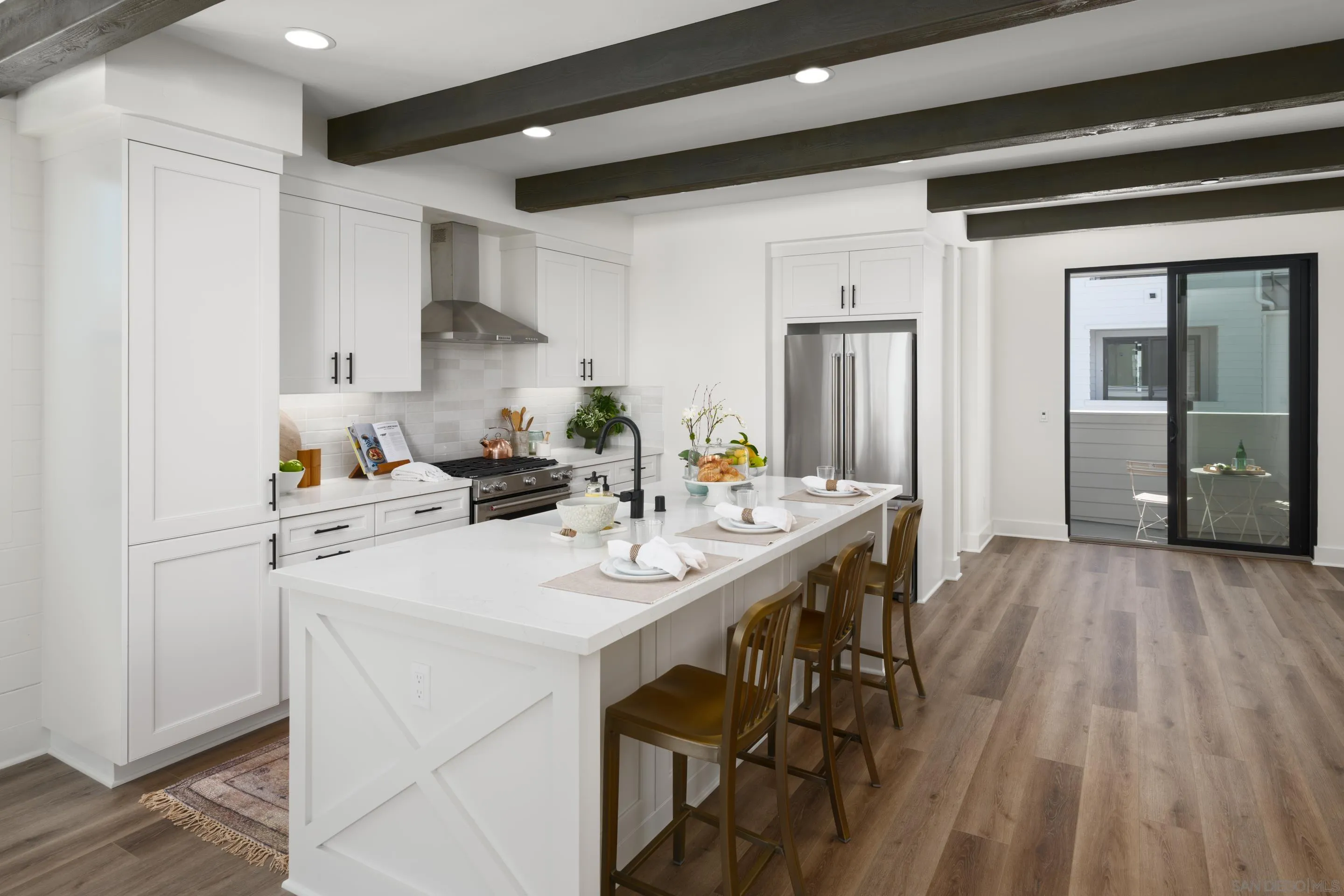 1301 Bergamo Place, Unit 101 Encinitas, CA 92024 - Photo 10 of 43 a kitchen with a sink and cabinets