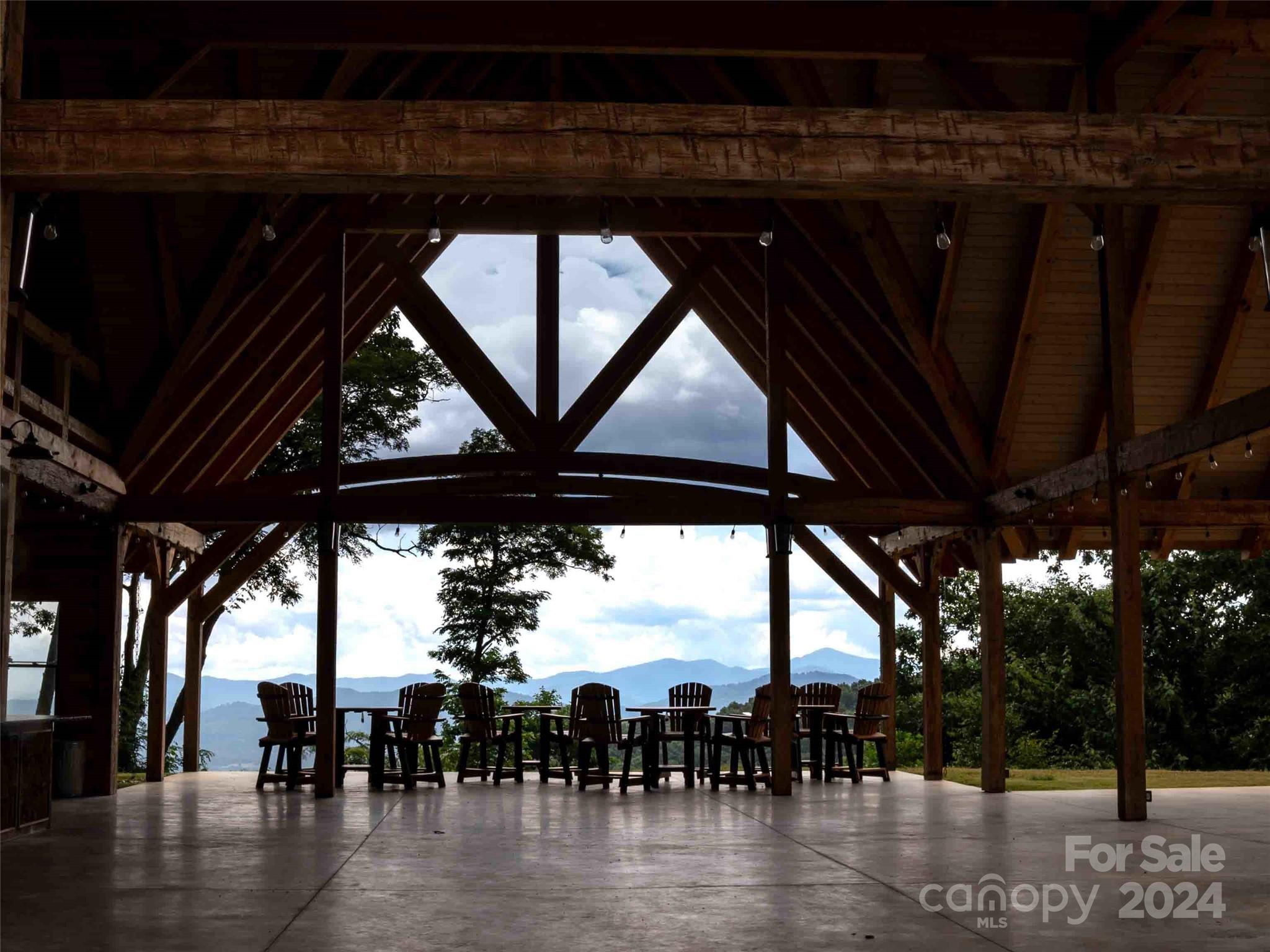 32 Tapestry Trail Waynesville, NC 28785 - Photo 19 of 27 a roof deck with table and chairs