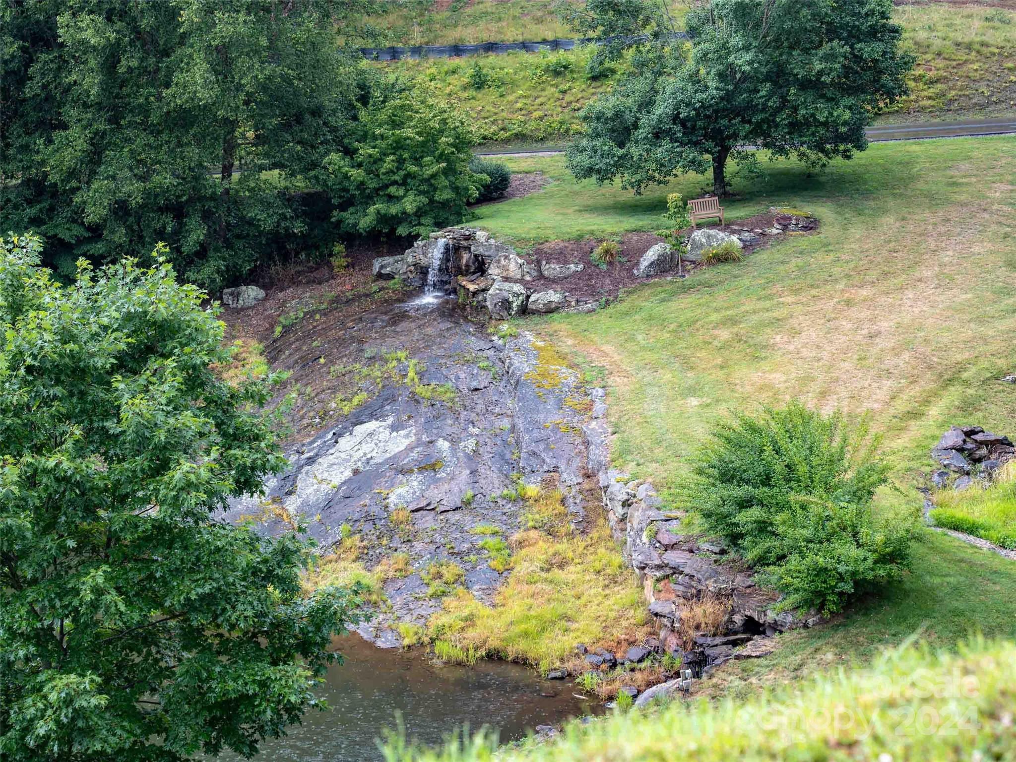 32 Tapestry Trail Waynesville, NC 28785 - Photo 20 of 27 a view of a lake with a yard
