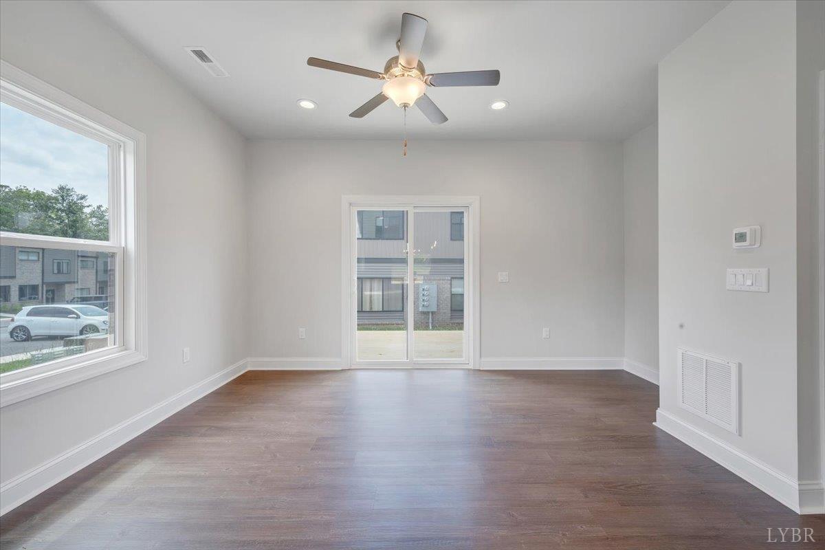 80 Shotman Road Rustburg, VA 24588 - Photo 4 of 23 wooden floor in an empty room with a window