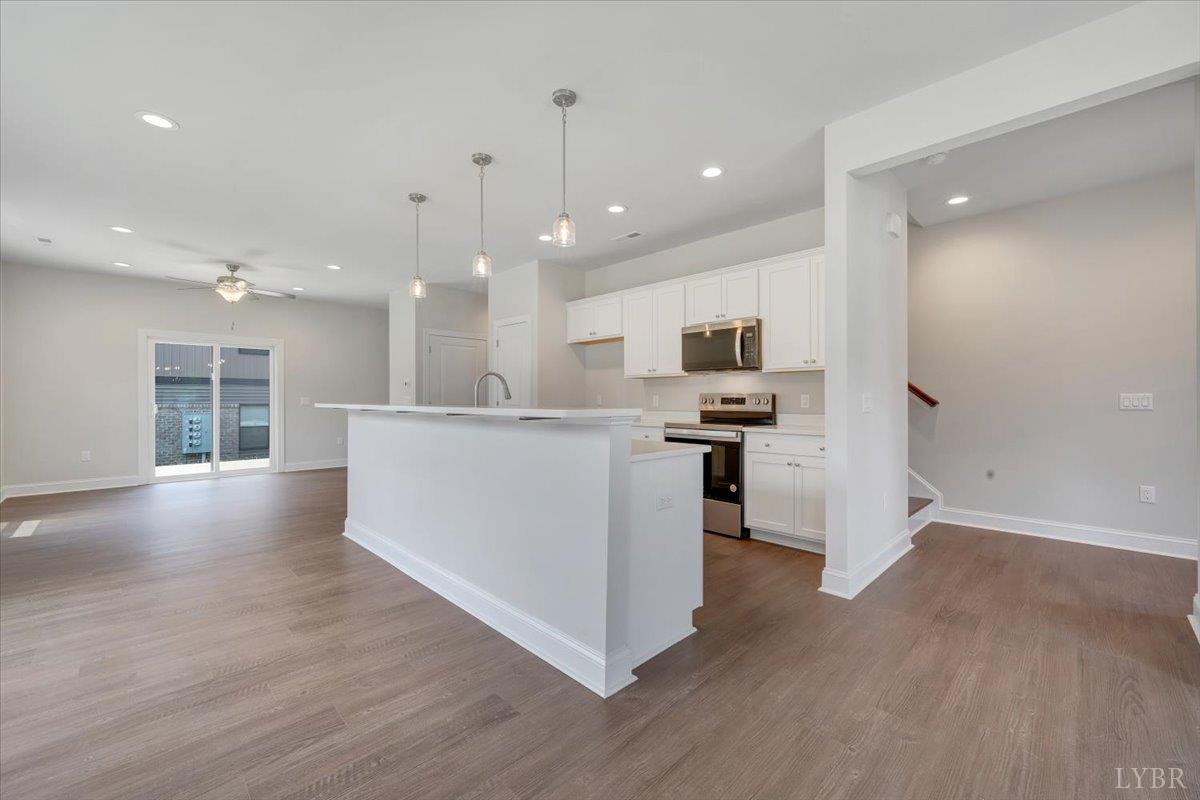 80 Shotman Road Rustburg, VA 24588 - Photo 6 of 23 a view of kitchen with refrigerator and microwave