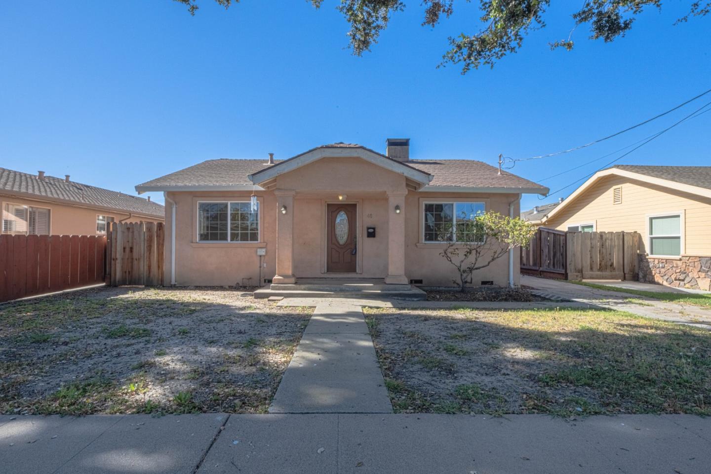 40 Oak Street Salinas, CA 93901 - Photo 1 of 28 a front view of a house with a yard