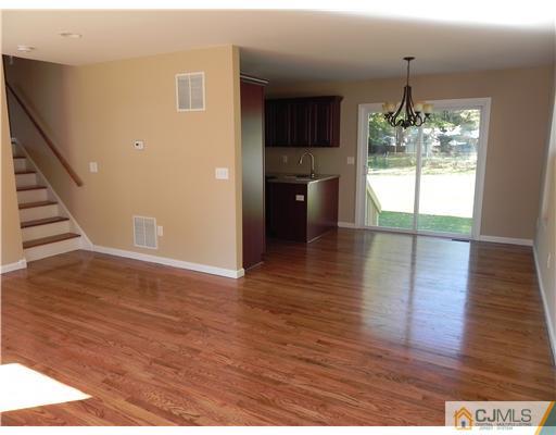 5 Eastlick Road Edison, NJ 08817 - Photo 3 of 16 a view of a room with wooden floor and staircase
