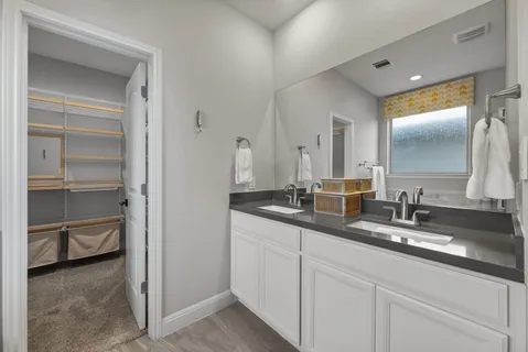 a view of a dining room with furniture and a window