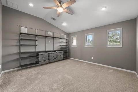 a view of an empty room with a cabinet