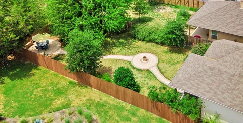 an empty room with wooden floor and entrance
