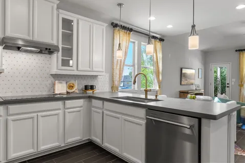a kitchen with stainless steel appliances a refrigerator and a stove top oven