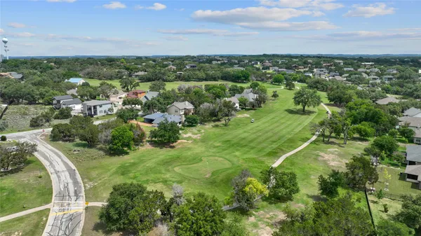 an aerial view of a house with a lake view