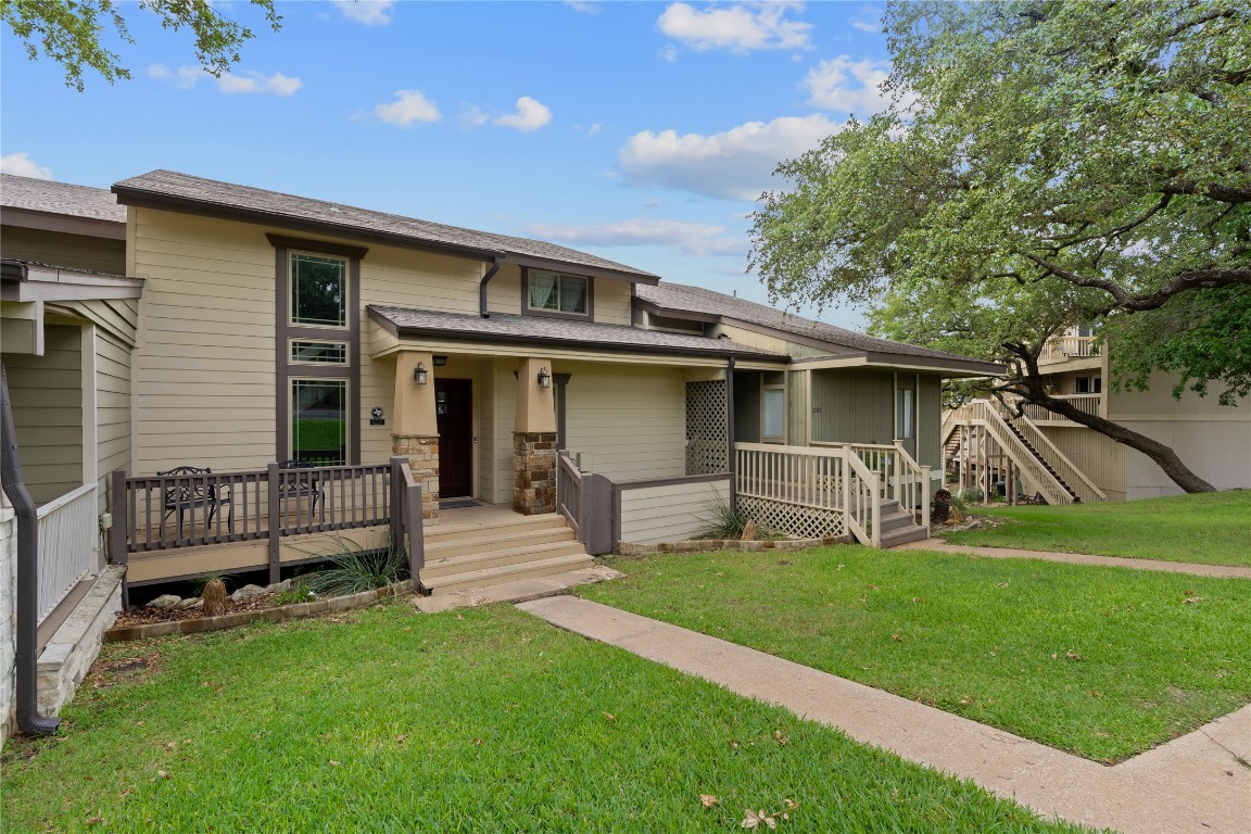 287 Venture Boulevard South Point Venture, TX 78645 - Photo 3 of 40 a front view of a house with garden