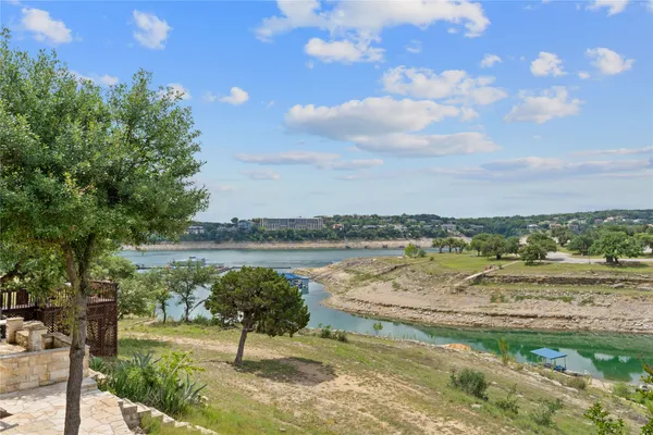 a view of lake with green space