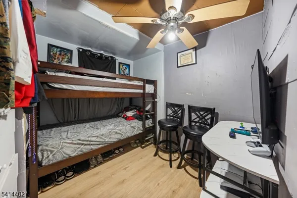 a bedroom with a bed and a tv