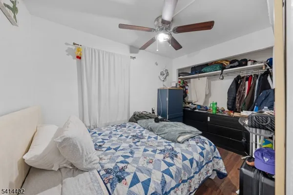 a bedroom with a bed and a walk in closet