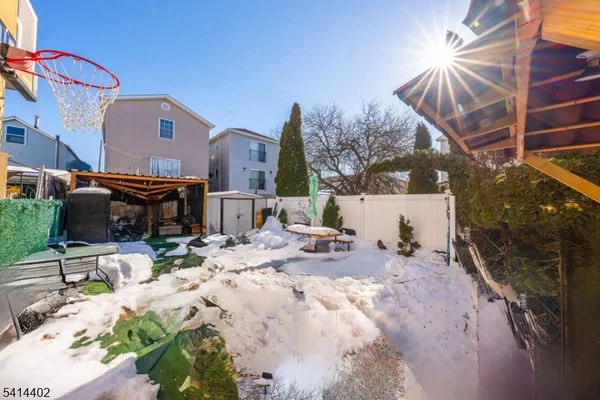 a view of a backyard with sitting area