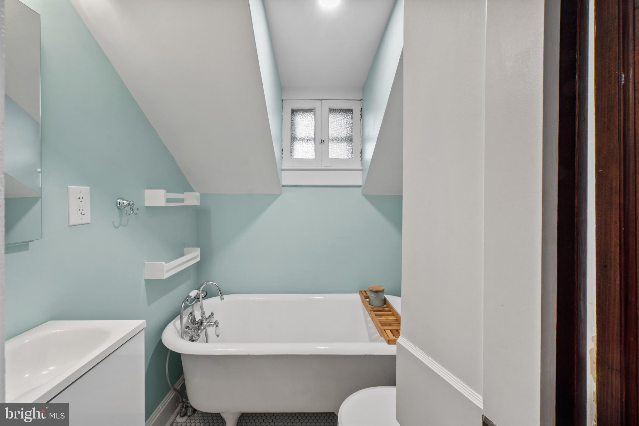 2900 Rueckert Avenue Baltimore, MD 21214 - Photo 30 of 40 a bathroom with a sink and bathtub