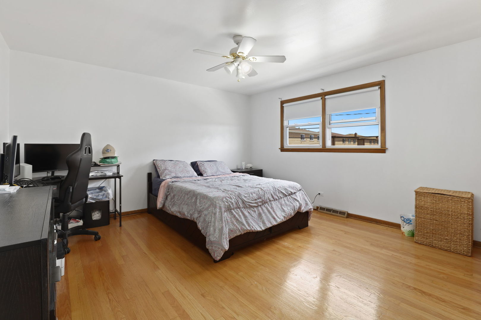 3939 Bobby Lane Schiller Park, IL 60176 - Photo 11 of 26 a bedroom with a bed and dresser with wooden floor
