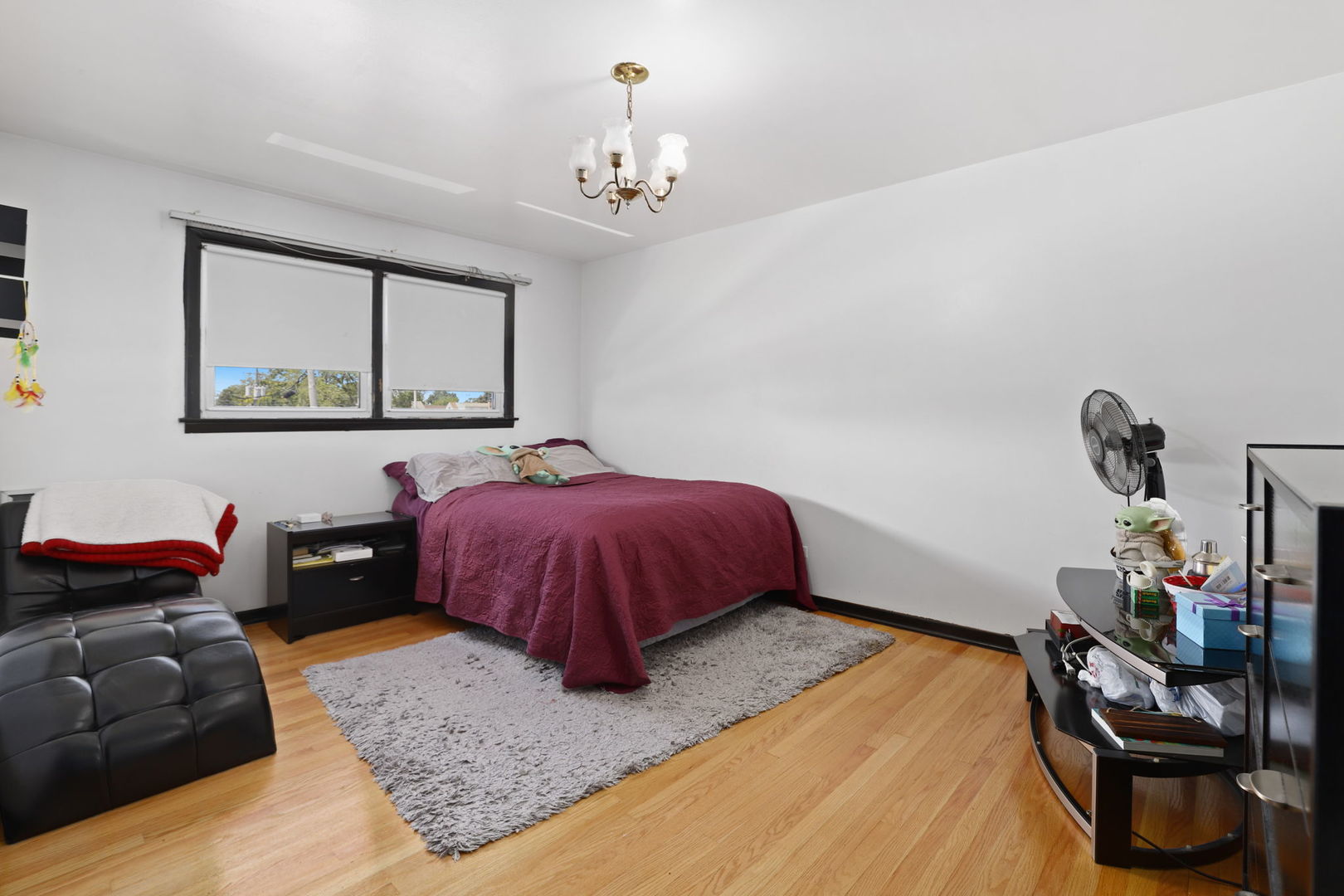 3939 Bobby Lane Schiller Park, IL 60176 - Photo 16 of 26 a bedroom with a bed and wooden floor