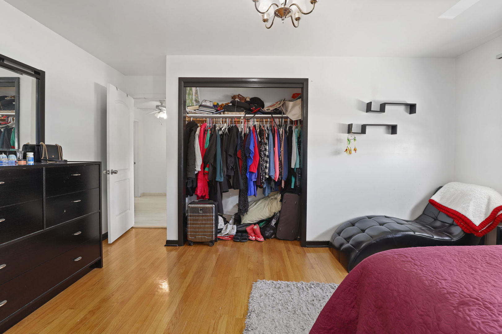 3939 Bobby Lane Schiller Park, IL 60176 - Photo 17 of 26 a view of walk in closet with clothes and shoes