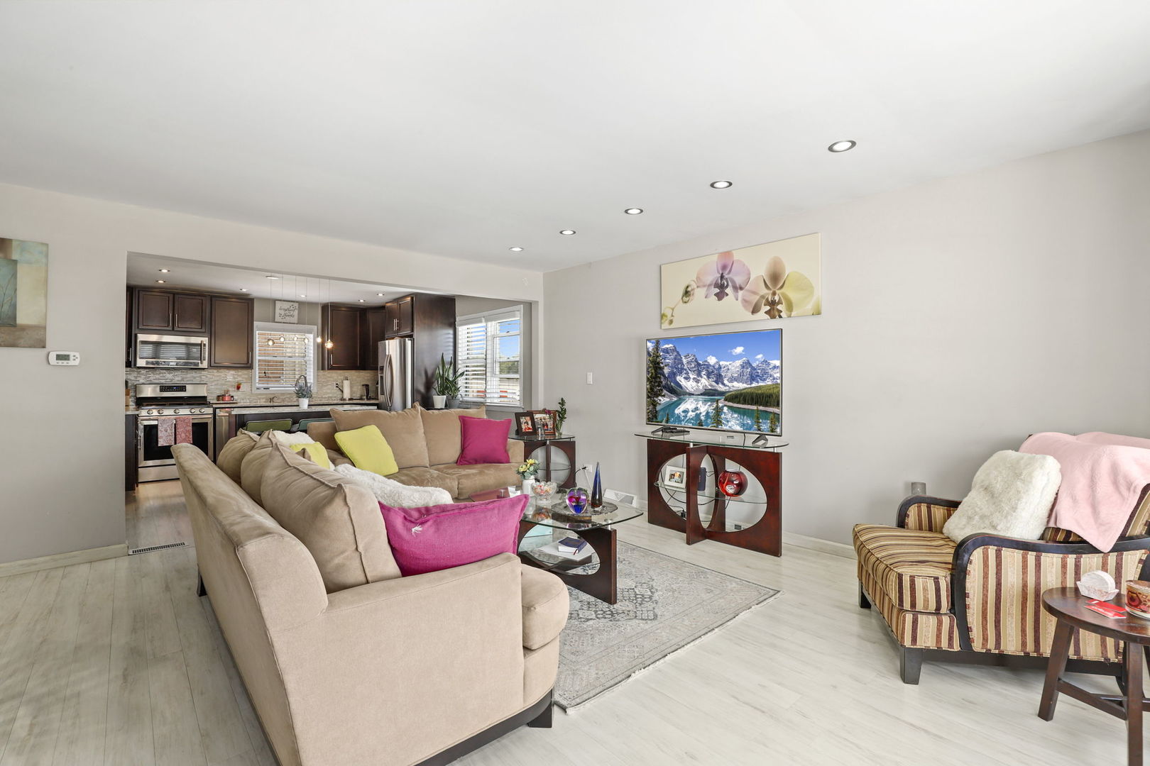3939 Bobby Lane Schiller Park, IL 60176 - Photo 5 of 26 a living room with furniture and a flat screen tv