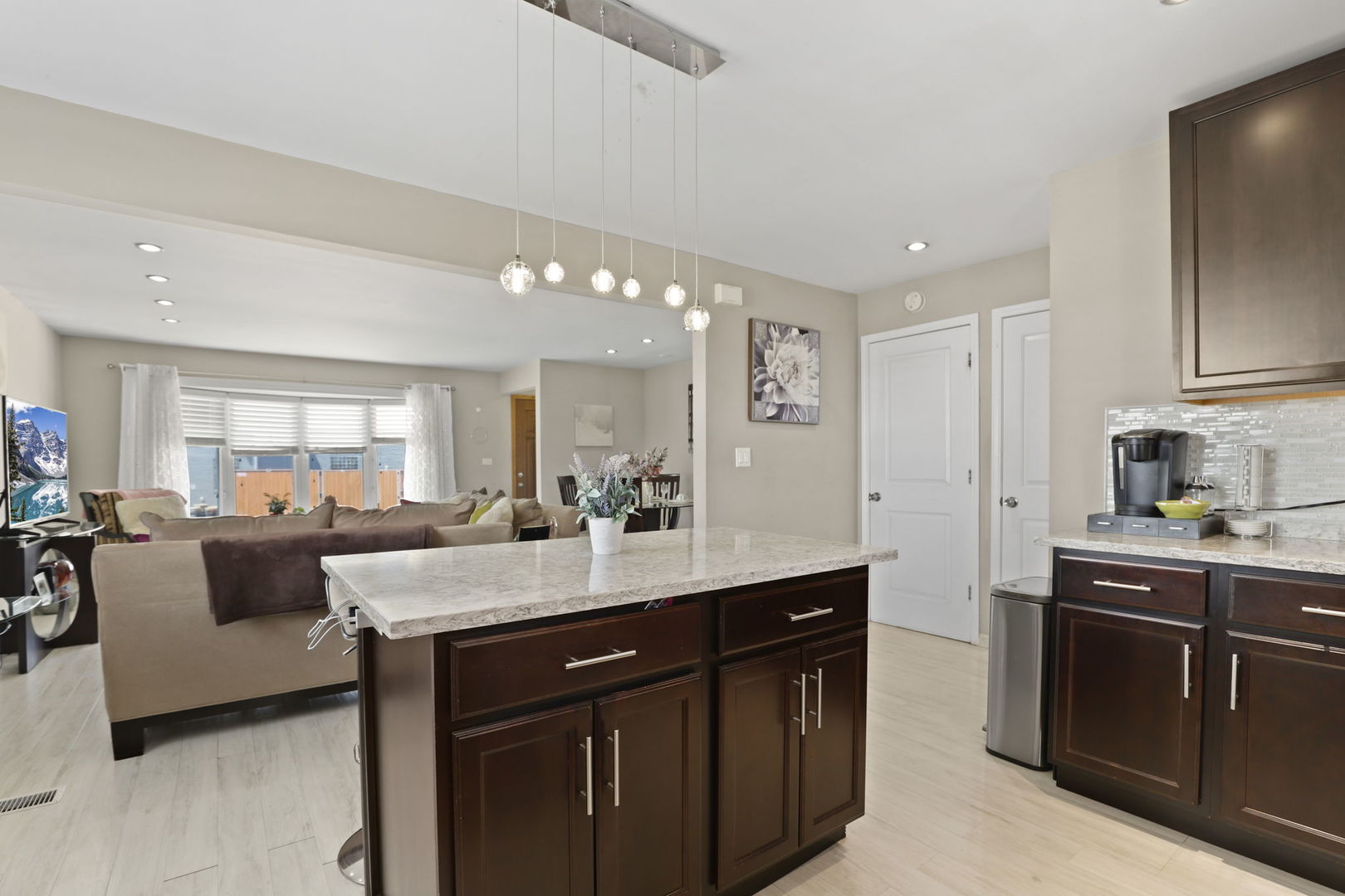 3939 Bobby Lane Schiller Park, IL 60176 - Photo 9 of 26 a kitchen with a sink and cabinets