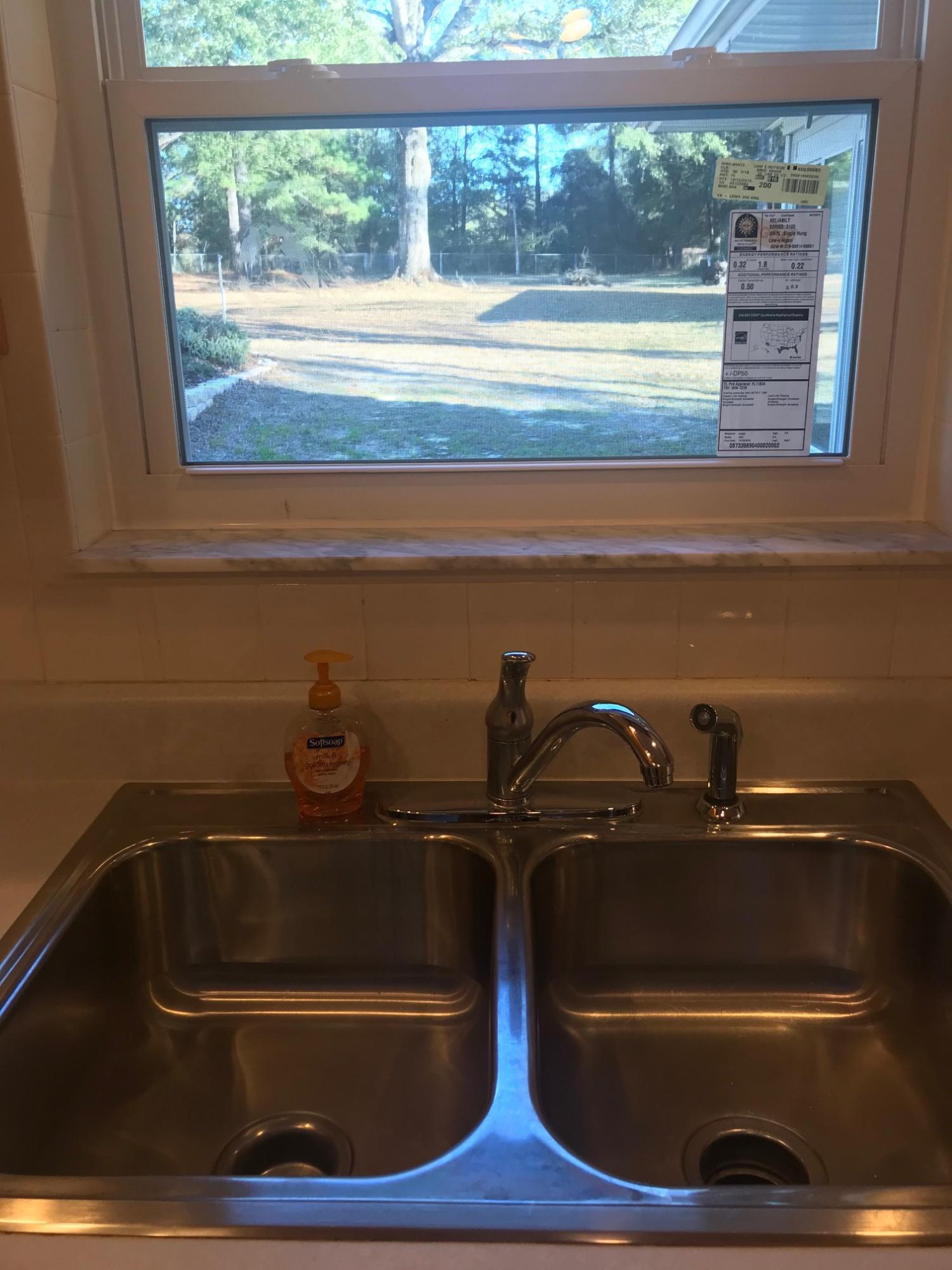 3606 Airport Road Crestview, FL 32539 - Photo 11 of 57 a close view of sink and a microwave