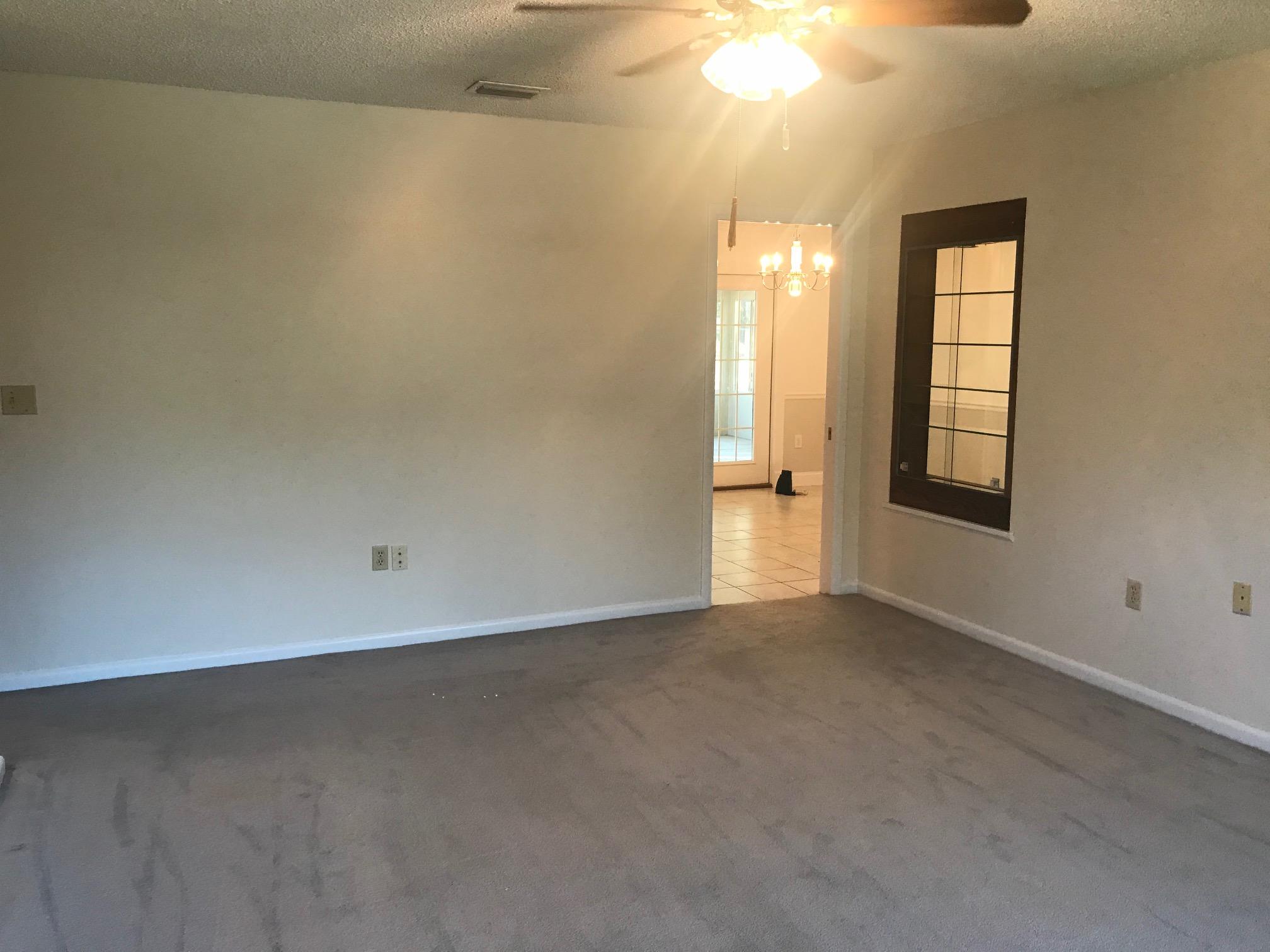 3606 Airport Road Crestview, FL 32539 - Photo 14 of 57 an empty room with windows and closet