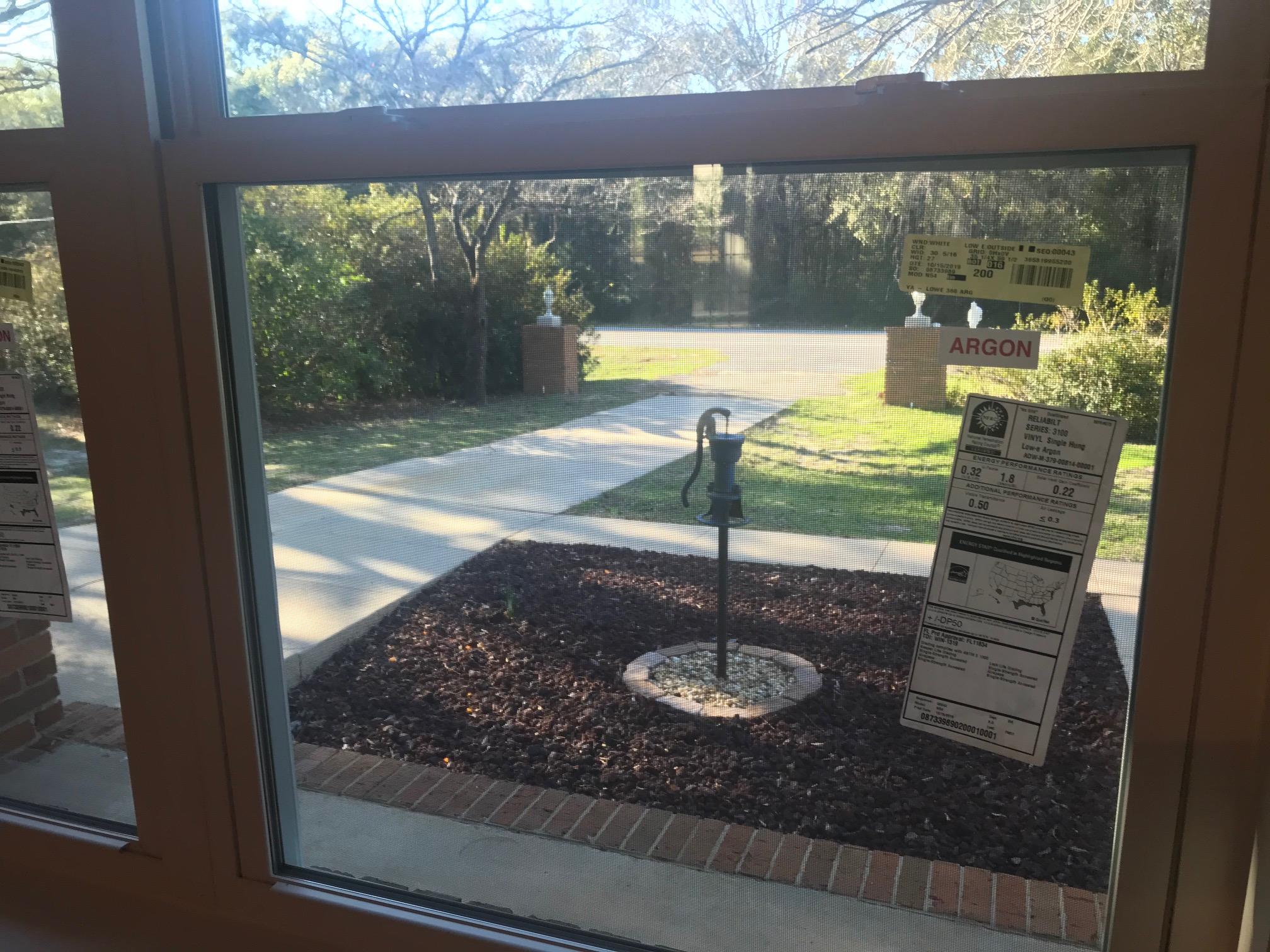3606 Airport Road Crestview, FL 32539 - Photo 16 of 57 a view of a floor to ceiling window and a yard
