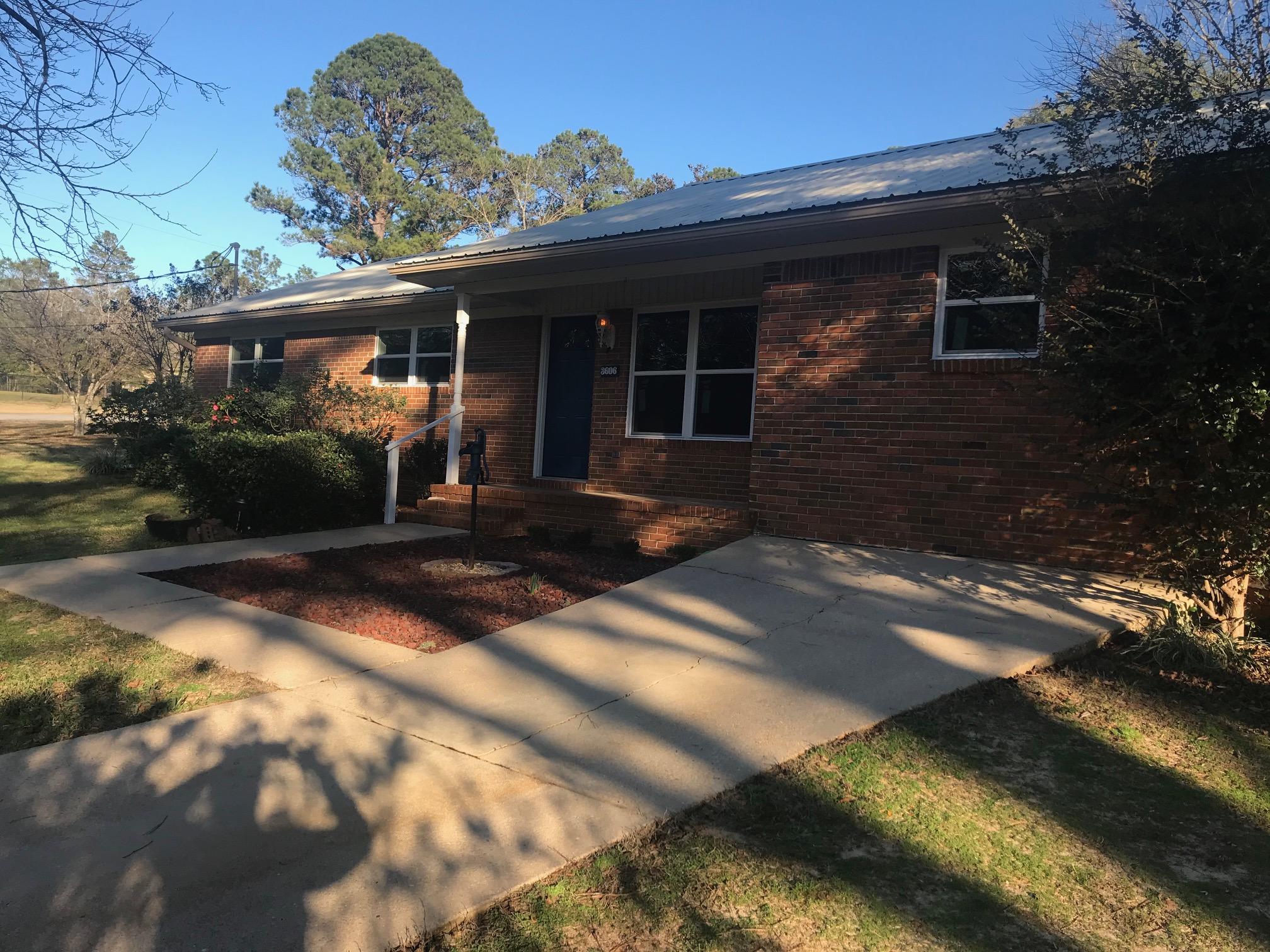 3606 Airport Road Crestview, FL 32539 - Photo 2 of 57 a front view of a house with a yard
