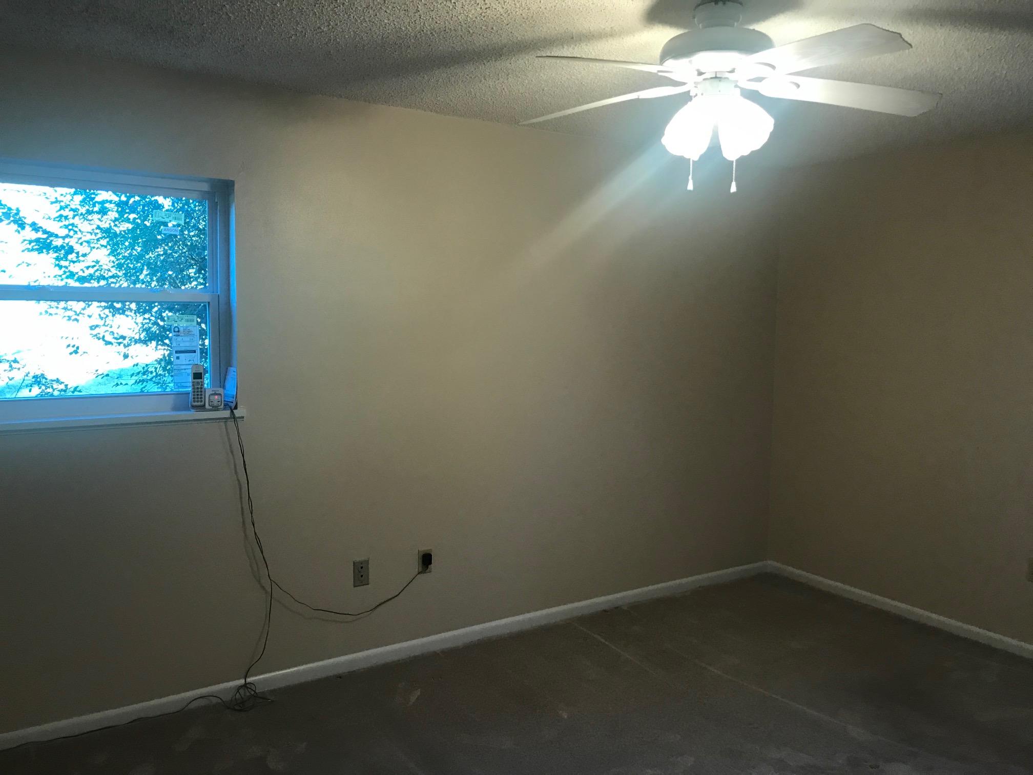 3606 Airport Road Crestview, FL 32539 - Photo 30 of 57 a view of a small space with wooden floor and windows