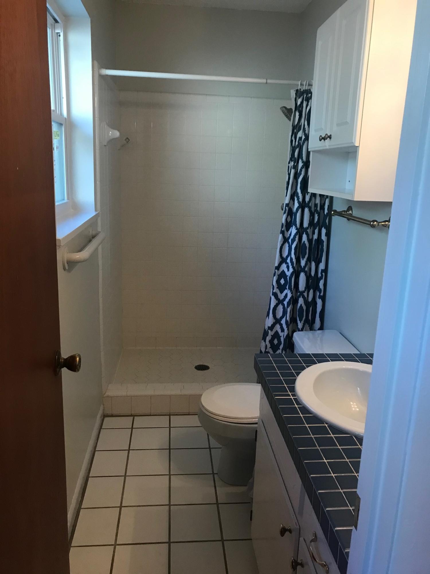 3606 Airport Road Crestview, FL 32539 - Photo 32 of 57 a bathroom with a granite countertop sink toilet and shower