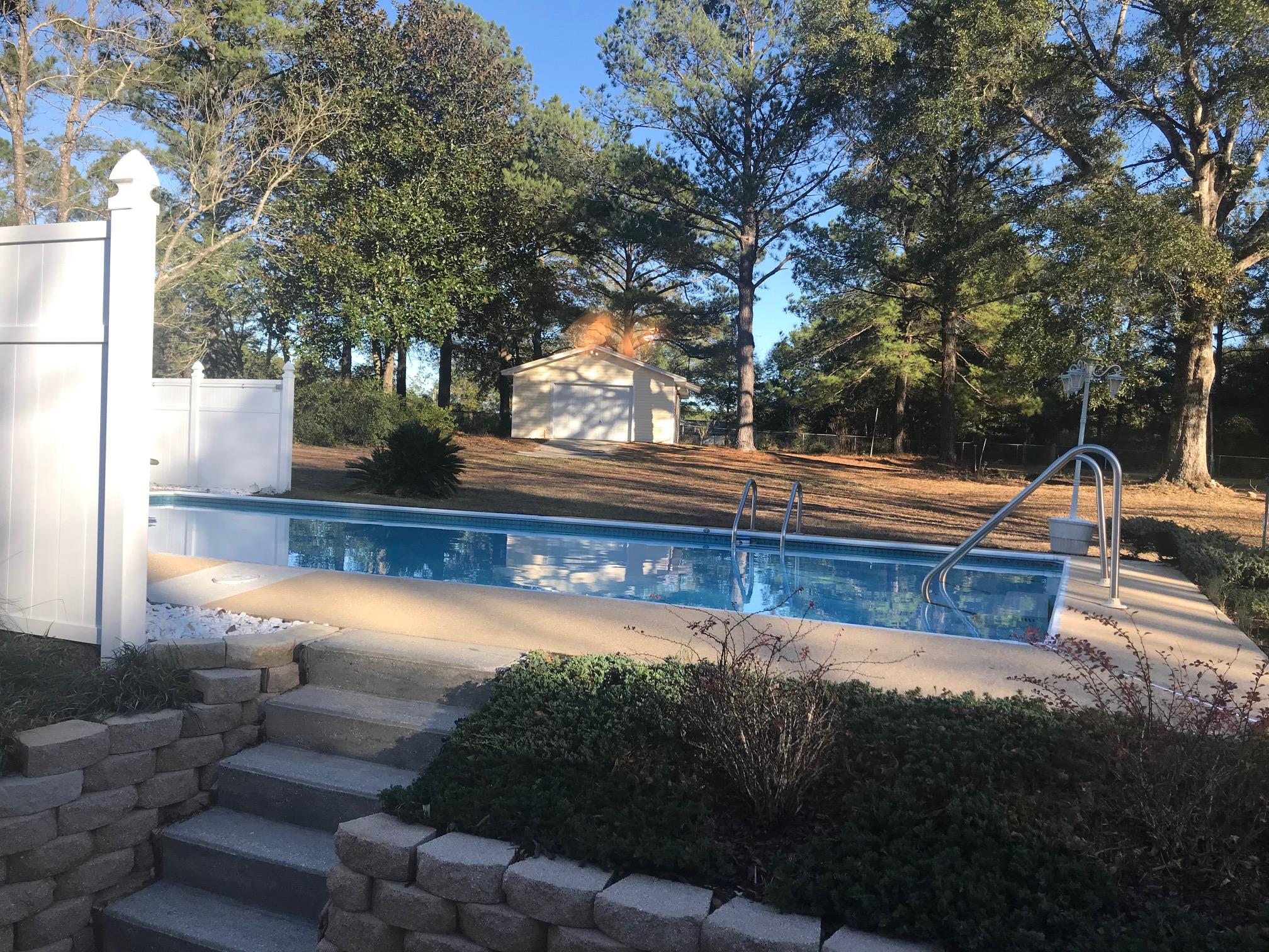 3606 Airport Road Crestview, FL 32539 - Photo 33 of 57 a view of a house with backyard and tree